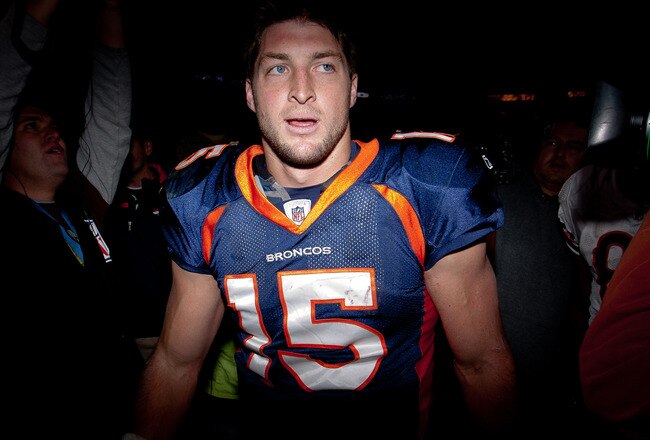 DENVER, CO - DECEMBER 11:  Quarterback Tim Tebow #15 of the Denver Broncos walks off the field after winning in overtime against the Chicago Bears at Sports Authority Field at Mile High on December 11, 2011 in Denver, Colorado. The Broncos defeated the Bears 13-10 in overtime. (Photo by Justin Edmonds/Getty Images)