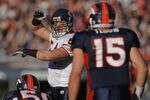 DENVER, CO - DECEMBER 11:  Linebacker Brian Urlacher #54 of the Chicago Bears runs the defense against quarterback Tim Tebow #15 of the Denver Broncos at Sports Authority Field at Mile High on December 11, 2011 in Denver, Colorado. The Broncos defeated the Bears 13-10 in overtime.  (Photo by Doug Pensinger/Getty Images)