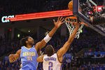 OKLAHOMA CITY, OK - APRIL 20: Thabo Sefolosha #2 of the Oklahoma City Thunder shoots the ball against Nene Hilario #31 of the Denver Nuggetsin Game Two of the Western Conference Quarterfinals in the 2011 NBA Playoffs on April 20, 2011 at the Ford Center in Oklahoma City, Oklahoma. NOTE TO USER: User expressly acknowledges and agrees that, by downloading and or using this photograph, User is consenting to the terms and conditions of the Getty Images License Agreement. (Photo by Dilip Vishwanat/Getty Images)