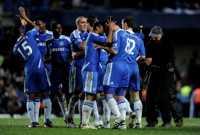 LONDON, ENGLAND - DECEMBER 12:  Scorer of the match winning goal, Frank Lampard (#8) of Chelsea is congratulated by teammate Ashley Cole following the final whistle during the Barclays Premier League match between Chelsea and Manchester City at Stamford Bridge on December 12, 2011 in London, England.  (Photo by Michael Regan/Getty Images)