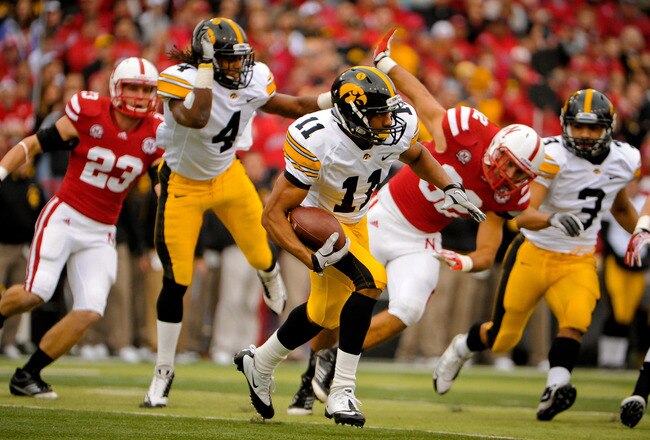 LINCOLN, NE - NOVEMBER 25: Wide receiver Kevonte Martin-Manley #11 of the Iowa Hawkeyes runs into the Nebraska Cornhusker defense during their game at Memorial Stadium November 25, 2011 in Lincoln, Nebraska. Nebraska defeated Iowa 20-7. (Photo by Eric Francis/Getty Images)