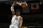 DENVER, CO - MARCH 21:  Nene #31 of the Denver Nuggets dunks the ball in front of Amir Johnson #15 of the Toronto Raptors at the Pepsi Center on March 21, 2011 in Denver, Colorado. NOTE TO USER: User expressly acknowledges and agrees that, by downloading and or using this photograph, User is consenting to the terms and conditions of the Getty Images License Agreement.  (Photo by Doug Pensinger/Getty Images)