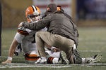 PITTSBURGH, PA - DECEMBER 08:  Colt McCoy #12 of the Cleveland Browns lays on the ground while speaking to athletic trainers after a helmet to helmet hit from James Harrison #92 of the Pittsburgh Steelers during the game on December 8, 2011 at Heinz Field in Pittsburgh, Pennsylvania.  (Photo by Jared Wickerham/Getty Images)