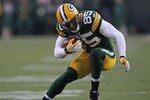 GREEN BAY, WI - DECEMBER 11: Greg Jennings #85 of the Green Bay Packers advances the ball against the Oakland Raiders at Lambeau Field on December 11, 2011 in Green Bay, Wisconsin. The Packers defeated the Raiders 46-16. (Photo by Jonathan Daniel/Getty Images)