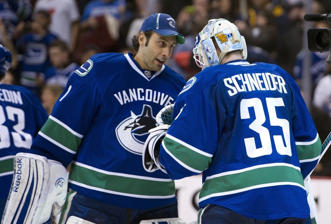 VANCOUVER, CANADA - NOVEMBER 29: Goalie Roberto Luongo #1 of the Vancouver Canucks congratulates goalie Cory Schneider #35 after defeating the Columbus Blue Jackets in NHL action on November 29, 2011 at Rogers Arena in Vancouver, British Columbia, Canada.  (Photo by Rich Lam/Getty Images)