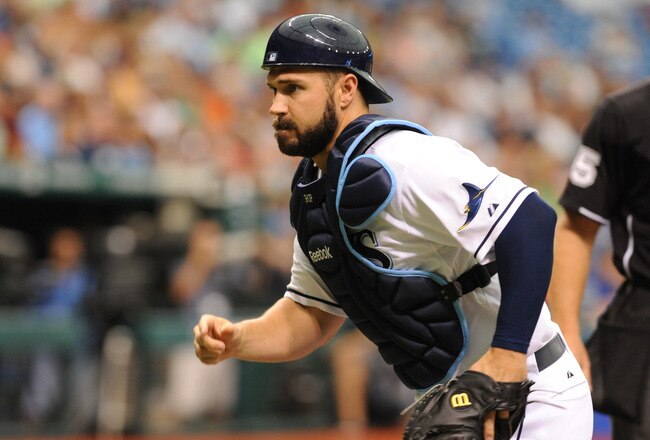 ST. PETERSBURG, FL - AUGUST 25:  Catcher Kelly Shoppach #10 of the Tampa Bay Rays looks for a wild pitch against the Detroit Tigers August 25, 2011 at Tropicana Field in St. Petersburg, Florida. (Photo by Al Messerschmidt/Getty Images)