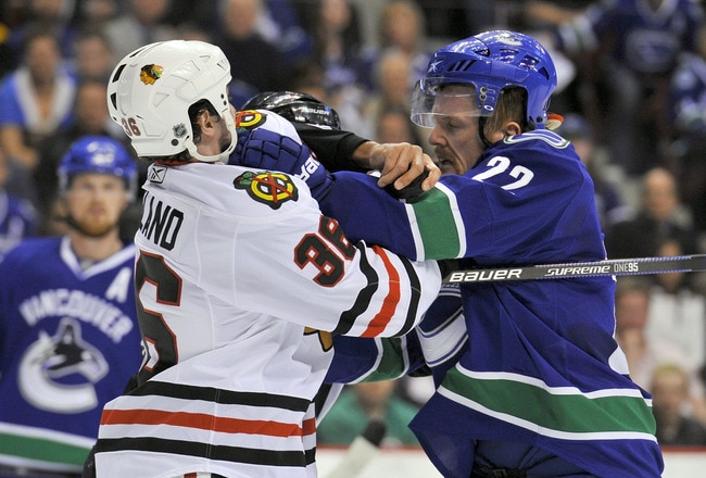 VANCOUVER, CANADA - MAY 5:  Daniel Sedin #22 of the Vancouver Canucks and Dave Bolland #36 of the Chicago Blackhawks tussle prior to a face-off during the first period in Game Three of the Western Conference Semifinals during the 2010 NHL Stanley Cup Playoffs on May 5, 2010 at General Motors Place in Vancouver, British Columbia, Canada.  (Photo by Rich Lam/Getty Images)