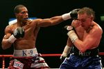 NEWCASTLE, UNITED KINGDOM - MARCH 30:  Colin McNeil (R) of the UK fights against Cornelius Bundrage of the U.S. during the Contender Challenge Light-Middleweight match between the UK and USA at the Metro Radio Arena March 30, 2007 in Newcastle, England.  (Photo by Matthew Lewis/Getty Images)