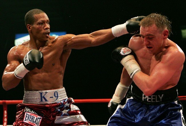 NEWCASTLE, UNITED KINGDOM - MARCH 30:  Colin McNeil (R) of the UK fights against Cornelius Bundrage of the U.S. during the Contender Challenge Light-Middleweight match between the UK and USA at the Metro Radio Arena March 30, 2007 in Newcastle, England.  (Photo by Matthew Lewis/Getty Images)