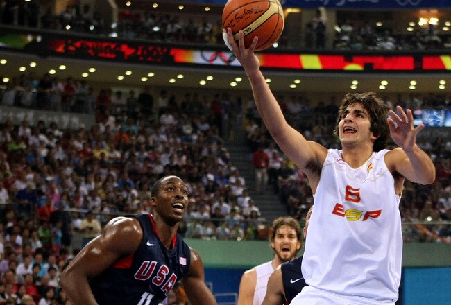 BEIJING - AUGUST 24:  Ricky Rubio #6 of Spain lays the ball up past Dwight Howard #11 of the United States in the gold medal game during Day 16 of the Beijing 2008 Olympic Games at the Beijing Olympic Basketball Gymnasium on August 24, 2008 in Beijing, China.  (Photo by Jed Jacobsohn/Getty Images)
