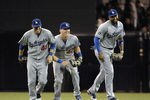 SAN DIEGO, CA - SEPTEMBER 23:  Trent Oeltjen #49, Jerry Sands #47 and Matt Kemp #27 of the Los Angeles Dodgers celebrate after getting the final out during the ninth inning of a baseball game against the San Diego Padres at Petco Park on September 23, 2011 in San Diego, California.  The Dodgers won 2-0. (Photo by Denis Poroy/Getty Images)