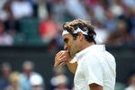 LONDON, ENGLAND - JUNE 29:  Roger Federer of Switzerland wipes his face during his quarterfinal round match against Jo-Wilfried Tsonga of France on Day Nine of the Wimbledon Lawn Tennis Championships at the All England Lawn Tennis and Croquet Club on June 29, 2011 in London, England.  (Photo by Julian Finney/Getty Images)