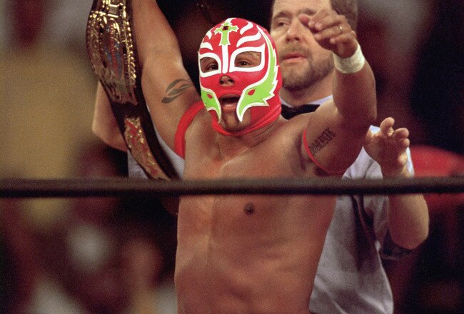 SAN DIEGO - JULY 12:  New cruiserweight champion Rey Mysterio Jr acknowledges the crowd after defeating Jericho during the WWE Bash at the Beach event at Cox Arena in San Diego, California on July 12, 1998.  (Photo by Elsa /Getty Images)