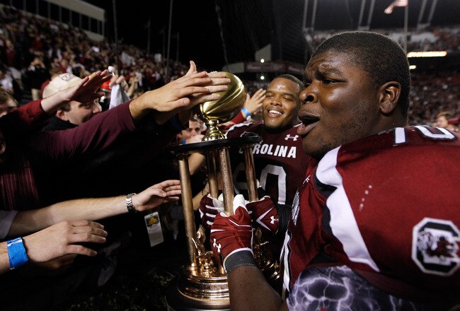 COLUMBIA, SC - NOVEMBER 26:  Teammates Terrence Campbell #60 of the South Carolina Gamecocks and Kyle Harris #70 celebrate after defeating the Clemson Tigers 34-13 at Williams-Brice Stadium on November 26, 2011 in Columbia, South Carolina.  (Photo by Streeter Lecka/Getty Images)