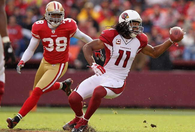 SAN FRANCISCO, CA - NOVEMBER 20:  Larry Fitzgerald #11 of the Arizona Cardinals can't hold on to a pass while defended by Dashon Goldson #38 of the San Francisco 49ers at Candlestick Park on November 20, 2011 in San Francisco, California.  (Photo by Ezra Shaw/Getty Images)