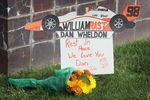 INDIANAPOLIS, IN - OCTOBER 17:  Flower lay by the gate at the Indianapolis Motor Speedway along with other tributes left by fans to two-time Indianapolis 500 winner Dan Wheldon on October 17, 2011 in Indianapolis, Indiana. Wheldon, winner of the 2011 Indy 500, was killed in a crash yesterday at the Izod IndyCar series season finale at Las Vegas Motor Speedway.  (Photo by Scott Olson/Getty Images)