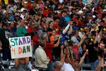 FORT WORTH, TX - NOVEMBER 06:  Fans Stand for Dan Wheldon on Lap 77 of the NASCAR Sprint Cup Series AAA Texas 500 at Texas Motor Speedway on November 6, 2011 in Fort Worth, Texas.  (Photo by Ronald Martinez/Getty Images)