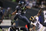 SEATTLE - DECEMBER 12:  Running back Marshawn Lynch #24 of the Seattle Seahawks rushes against Darell Scott #97 of the St. Louis Rams at CenturyLink Field on December 12, 2011 in Seattle, Washington. The Seahawks defeated the Rams 30-13. (Photo by Otto Greule Jr/Getty Images)