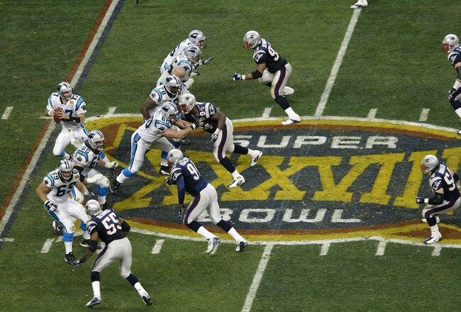 HOUSTON, TX - FEBRUARY 1:  Quarterback Jake Delhomme #17 of the Carolina Panthers drops back to pass against the New England Patriots in Super Bowl XXXVIII at Reliant Stadium on February 1, 2004 in Houston, Texas. The Patriots defeated the Panthers 32-29. (Photo by Ronald Martinez/Getty Images)