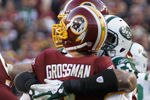 LANDOVER, MD - DECEMBER 04:  Aaron Maybin #51 of the New York Jets hits and forces a fumble on  Rex Grossman #8 of the Washington Redskins during the second half at FedExField on December 4, 2011 in Landover, Maryland.  (Photo by Rob Carr/Getty Images)