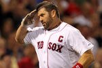 BOSTON - AUGUST 16: Jason Varitek #33 of the Boston Red Sox salutes a teammate after hitting a home run against the Tampa Bay Rays in the second game of a doubleheader at Fenway Park on August 16, 2011 in Boston, Massachusetts.  (Photo by Jim Rogash/Getty Images)