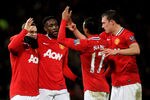 MANCHESTER, ENGLAND - DECEMBER 10:  (L-R) Wayne Rooney of Manchester United is congratulated by teammates Danny Welbeck, Nani and Phil Jones after scoring his team's second goal during the Barclays Premier League match between Manchester United and Wolverhampton Wanderers at Old Trafford on December 10, 2011 in Manchester, England.  (Photo by Alex Livesey/Getty Images)