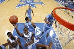 LEXINGTON, KY - DECEMBER 3: Darius Miller #1 of the Kentucky Wildcats goes up for a shot past John Henson #31 of the North Carolina Tar Heels at Rupp Arena on December 3, 2011 in Lexington, Kentucky. Kentucky won 73-72. (Photo by Joe Robbins/Getty Images)