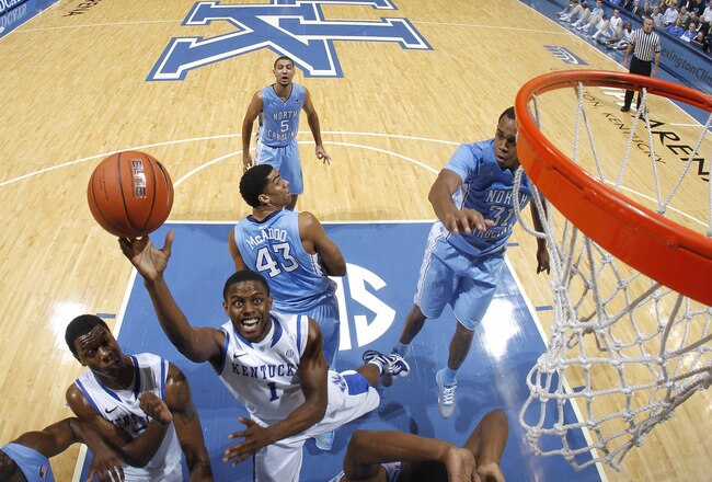 LEXINGTON, KY - DECEMBER 3: Darius Miller #1 of the Kentucky Wildcats goes up for a shot past John Henson #31 of the North Carolina Tar Heels at Rupp Arena on December 3, 2011 in Lexington, Kentucky. Kentucky won 73-72. (Photo by Joe Robbins/Getty Images)