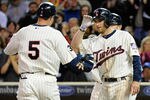 MINNEAPOLIS, MN - SEPTEMBER 26: Drew Butera #41 of the Minnesota Twins congratulates Michael Cuddyer #5 on a two-run home run against the Kansas City Royals in the fifth inning on September 26, 2011 at Target Field in Minneapolis, Minnesota. (Photo by Hannah Foslien/Getty Images)