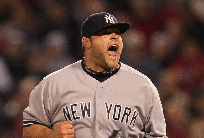 BOSTON - APRIL 06:  Joba Chamberlain #62 of the New York Yankees reacts after getting out of trouble in the 8th inning against the Boston Red Sox at Fenway Park on April 6, 2010 in Boston, Massachusetts. (Photo by Jim Rogash/Getty Images)