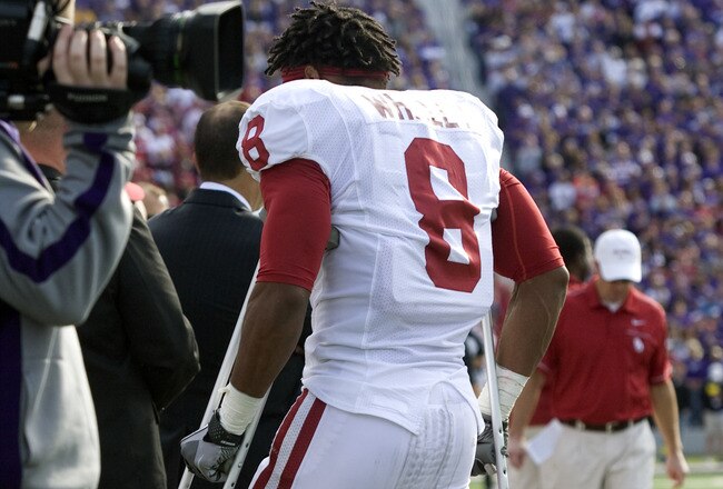 MANHATTAN, KS - OCTOBER 29:  Dominique Whaley #8 of the Oklahoma Sooners walks along the sideline on crutches after being injured in the first quarter during a game against the Kansas State Wildcats at Bill Snyder Family Stadium on October 29, 2011 in Manhattan, Kansas. (Photo by Ed Zurga/Getty Images)