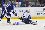 TAMPA, FL - NOVEMBER 22: Center Steven Stamkos #91 of the Tampa Bay Lightning and defenseman Luke Schenn #2 of the Toronto Maple Leafs battle for the puck November 22, 2011 at St. Pete Times Forum in Tampa, Florida.  (Photo by Al Messerschmidt/Getty Images)