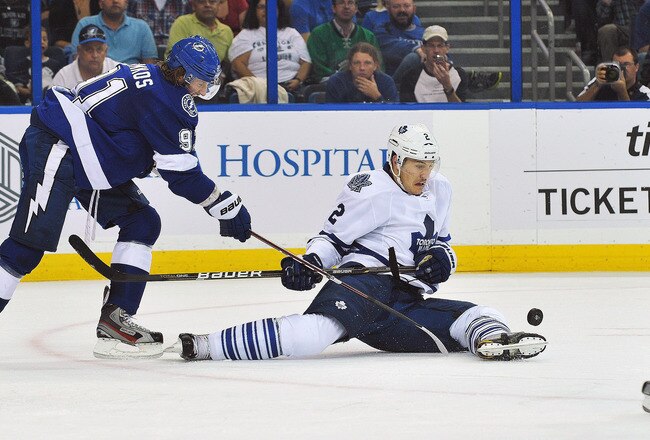 TAMPA, FL - NOVEMBER 22: Center Steven Stamkos #91 of the Tampa Bay Lightning and defenseman Luke Schenn #2 of the Toronto Maple Leafs battle for the puck November 22, 2011 at St. Pete Times Forum in Tampa, Florida.  (Photo by Al Messerschmidt/Getty Images)