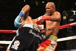 LOS ANGELES, CA - OCTOBER 15:  Bernard Hopkins (R) tangles with Chad Dawson as he falls to the canvas  in their WBC and Ring Magzine light heavyweight title fight at Staples Center on October 15, 2011 in Los Angeles, California. Hopkins injured his shoulder and was unable to continue and Dawson was awarded a TKO victory.  (Photo by Stephen Dunn/Getty Images)