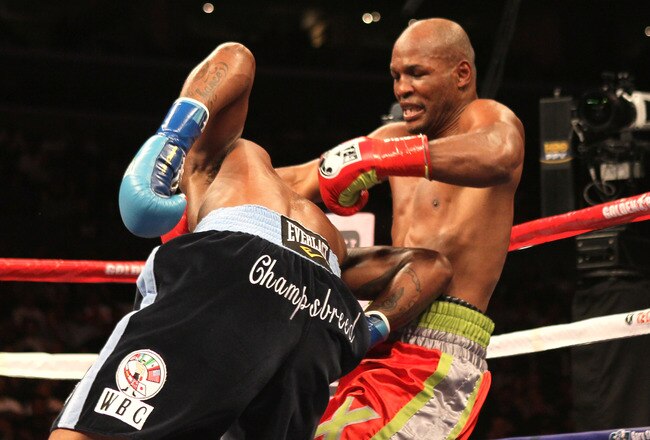 LOS ANGELES, CA - OCTOBER 15:  Bernard Hopkins (R) tangles with Chad Dawson as he falls to the canvas  in their WBC and Ring Magzine light heavyweight title fight at Staples Center on October 15, 2011 in Los Angeles, California. Hopkins injured his shoulder and was unable to continue and Dawson was awarded a TKO victory.  (Photo by Stephen Dunn/Getty Images)