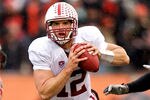 CORVALLIS, OR - NOVEMBER 5: Quarterback Andrew Luck #12 of the Stanford Cardinal rushes past defensive tackle Andrew Seumalo #49 of the Oregon State Beavers on November 5, 2011 at Reser Stadium in Corvallis, Oregon. Stanford won the game 38-13. (Photo by Craig Mitchelldyer/Getty Images)