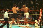 15 JAN 1990:  GEORGE FOREMAN (WHITE TRUNKS) THROWING A LEFT JAB INTO GERRY COONEY's BODY DURING THEIR BOUT AT ATLANTIC CITY. GEORGE FOREMAN WINS BY KNOCKOUT IN THE SECOND ROUND.