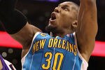 PHOENIX, AZ - JANUARY 30:  David West #30 of the New Orleans Hornets puts up a shot over Vince Carter #25 of the Phoenix Suns during the NBA game at US Airways Center on January 30, 2011 in Phoenix, Arizona.  NOTE TO USER: User expressly acknowledges and agrees that, by downloading and or using this photograph, User is consenting to the terms and conditions of the Getty Images License Agreement.  (Photo by Christian Petersen/Getty Images)