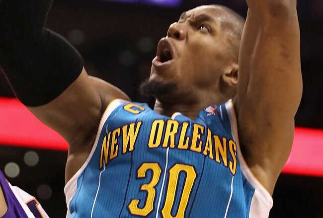 PHOENIX, AZ - JANUARY 30:  David West #30 of the New Orleans Hornets puts up a shot over Vince Carter #25 of the Phoenix Suns during the NBA game at US Airways Center on January 30, 2011 in Phoenix, Arizona.  NOTE TO USER: User expressly acknowledges and agrees that, by downloading and or using this photograph, User is consenting to the terms and conditions of the Getty Images License Agreement.  (Photo by Christian Petersen/Getty Images)