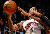 ATLANTA - DECEMBER 02:  Jamal Crawford #11 of the Atlanta Hawks is fouled by Sonny Weems #24 of the Toronto Raptors at Philips Arena on December 2, 2009 in Atlanta, Georgia.  NOTE TO USER: User expressly acknowledges and agrees that, by downloading and/or using this Photograph, User is consenting to the terms and conditions of the Getty Images License Agreement.  (Photo by Kevin C. Cox/Getty Images)