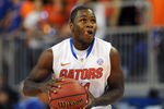 GAINESVILLE, FL -  NOVEMBER 11:  Guard Erving Walker #11 of the Florida Gators looks for a shot against the Jackson State Tigers November 11, 2011 at the Stephen C. O'Connell Center in Gainesville, Florida.  The Gators won 99 - 59. (Photo by Al Messerschmidt/Getty Images)