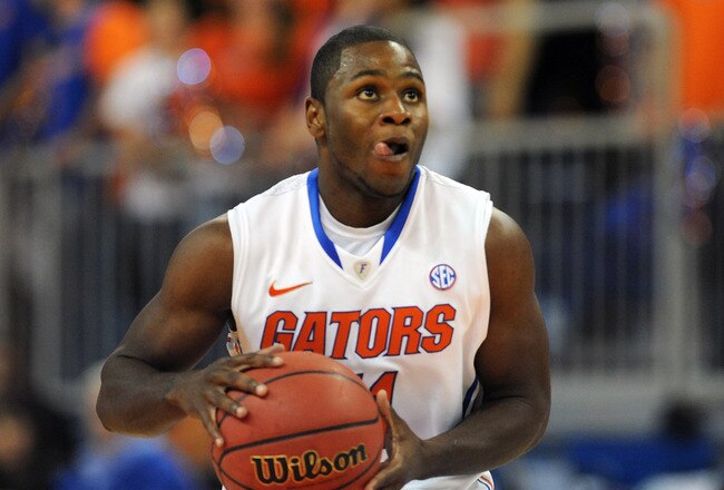 GAINESVILLE, FL -  NOVEMBER 11:  Guard Erving Walker #11 of the Florida Gators looks for a shot against the Jackson State Tigers November 11, 2011 at the Stephen C. O'Connell Center in Gainesville, Florida.  The Gators won 99 - 59. (Photo by Al Messerschmidt/Getty Images)