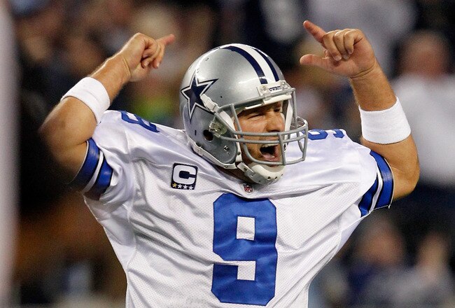 ARLINGTON, TX - DECEMBER 11:  Tony Romo #9 of the Dallas Cowboys celebrates after the Cowboys scored against the New York Giants in the fourth quarter at Cowboys Stadium on December 11, 2011 in Arlington, Texas.  (Photo by Tom Pennington/Getty Images)