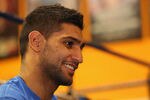 BOLTON, ENGLAND - DECEMBER 14:  Amir Khan faces the media during a press conference to reflect on his defeat by Lamont Peterson to lose his WBA and IBF light-welterweight titles at the Gloves Community Centre on December 14, 2011 in Bolton, England.  (Photo by Alex Livesey/Getty Images)
