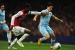 LONDON, ENGLAND - NOVEMBER 29:  Johan Djourou of Arsenal battles with Samir Nasri of Manchester City during the Carling Cup Quarter Final match between Arsenal and Manchester City at Emirates Stadium on November 29, 2011 in London, England.  (Photo by Michael Regan/Getty Images)