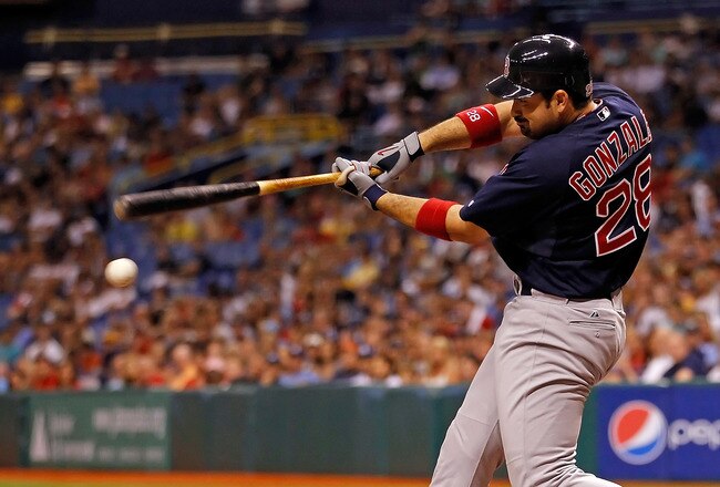 ST. PETERSBURG, FL - JULY 15:  Infielder Adrian Gonzalez #28 of the Boston Red Sox fouls off a pitch against the Tampa Bay Rays during the game at Tropicana Field on July 15, 2011 in St. Petersburg, Florida.  (Photo by J. Meric/Getty Images)