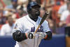FLUSHING, NY - AUGUST 4:  Mo Vaughn #42 of the New York Mets watches his two-run home run go over the wall in the first inning of their game against the Arizona Diamondbacks on August 4, 2002 at Shea Stadium in Flushing, New York.  The Diamondbacks defeated the Mets 12-7.  (Photo by Ezra Shaw/Getty Images)