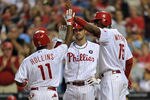 PHILADELPHIA, PA - MAY 23: Jimmy Rollins #11 of the Philadelphia Phillies is congratulated by teammates John Mayberry Jr. #15 and Cole Hamels #35 after hitting a three run home run in the bottom of the third inning during the game against the Cincinnati Reds at Citizens Bank Park on May 23, 2011 in Philadelphia, Pennsylvania. (Photo by Drew Hallowell/Getty Images)