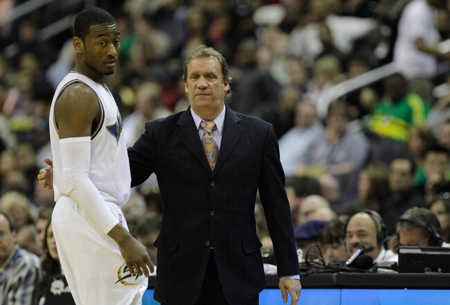 WASHINGTON, DC - FEBRUARY 26: Head coach Flip Saunders (R) talks with John Wall #2 of the Washington Wizards against the Dallas Mavericks at the Verizon Center on February 26, 2011 in Washington, DC. NOTE TO USER: User expressly acknowledges and agrees that, by downloading and or using this Photograph, user is consenting to the terms and conditions of the Getty Images License Agreement.  (Photo by Rob Carr/Getty Images)