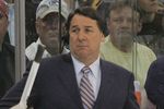 PITTSBURGH - MAY 04: TV commentator Mike Milbury works between the benches in the game between the Pittsburgh Penguins and the New York Rangers during game five of the Eastern Conference Semifinals of the 2008 NHL Stanley Cup Playoffs on May 4, 2008 at the Mellon Arena in Pittsburgh, Pennsylvania. The Penguins defeated the Rangers 3-2 in overtime to win the series 4 games to 1.  (Photo by Bruce Bennett/Getty Images)
